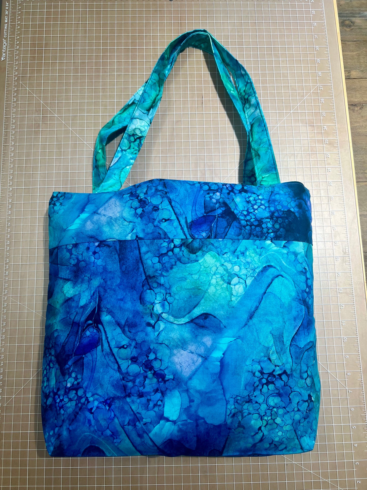Quilted Tote Bag; Outer pocket; Available in Blue/Green, Blue/Tan, Dallas Cowboys; 14" x 12"